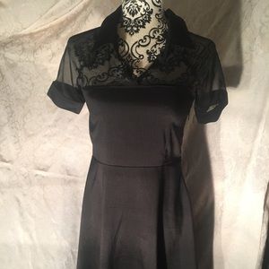 Black skater dress with sheer collared top